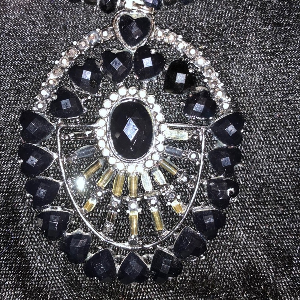 Black beaded necklace with stones.